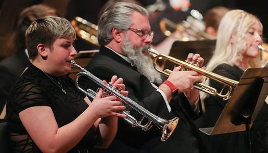 members of KSO play during a performance