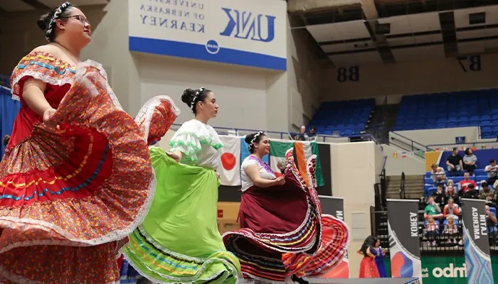 students put on a dance presentation at the international food festival event